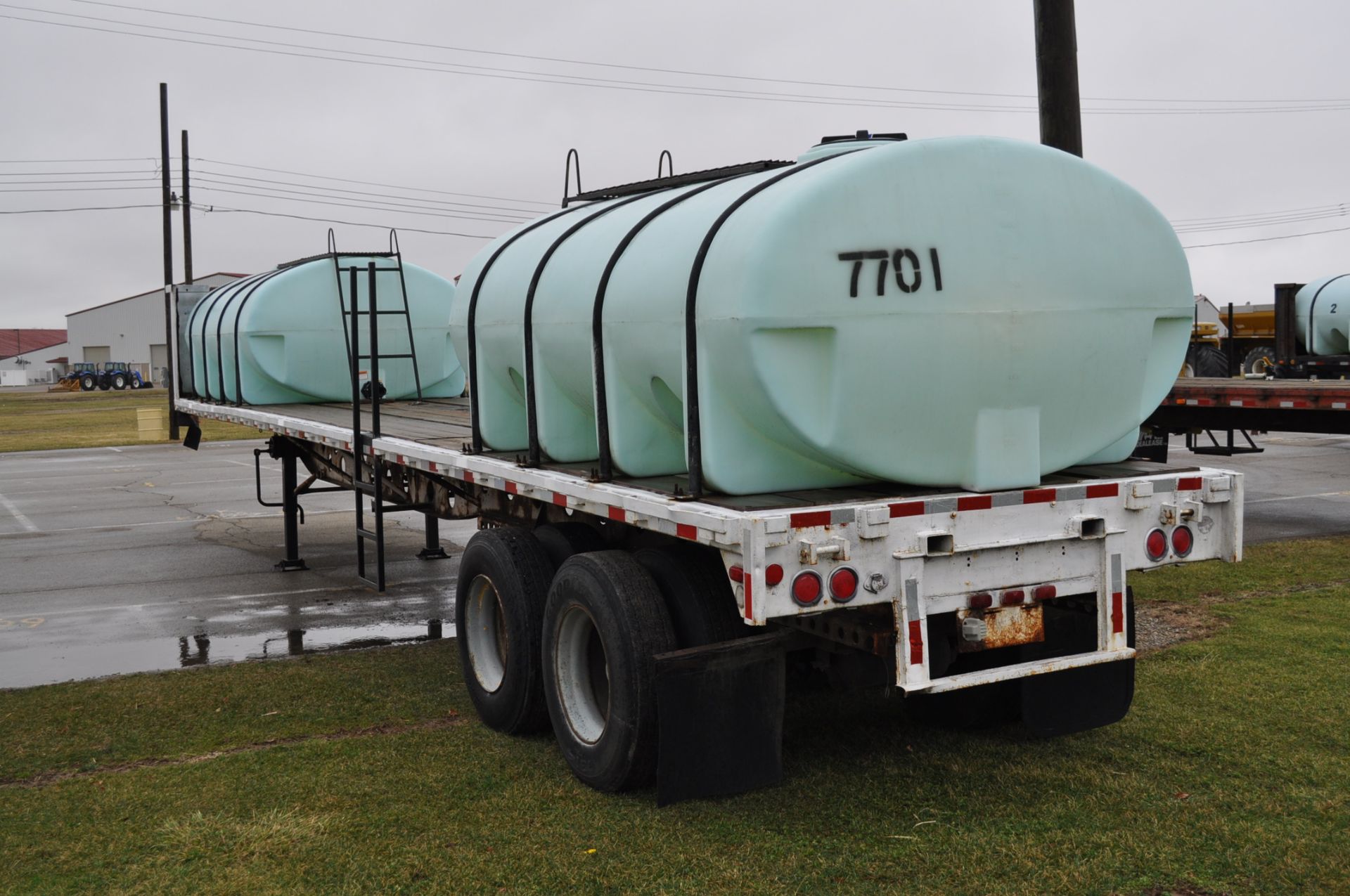 1977 Transcraft 42’ flat trailer with 2-2000gl poly tanks - Image 2 of 4