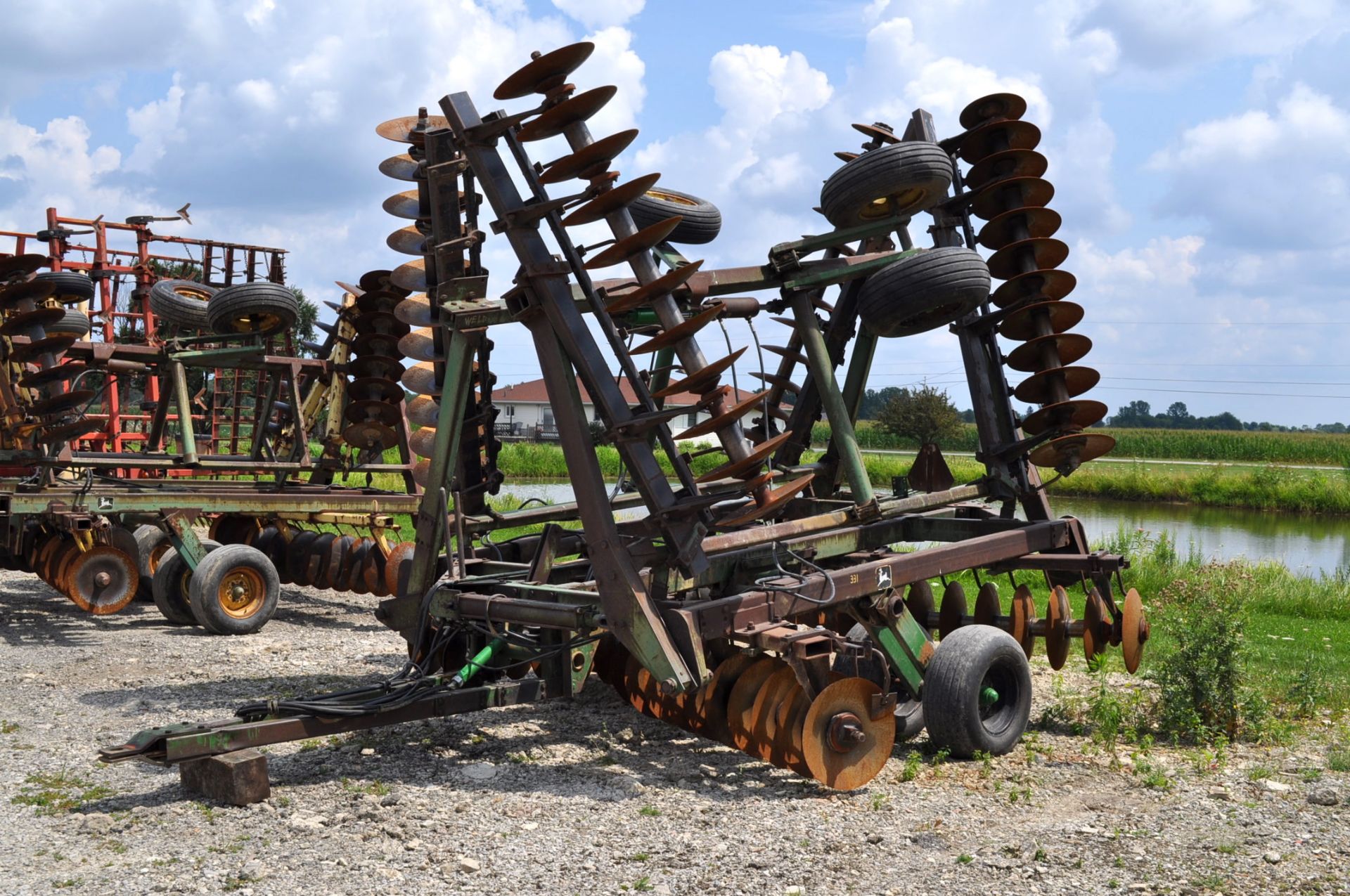 30’ John Deere 330 disc, 9” spacing, hyd fold, rear hitch