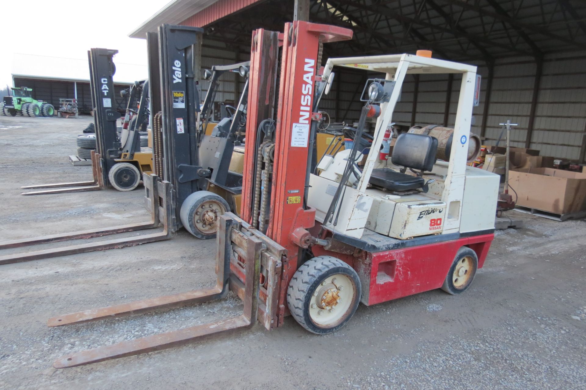 Nissan 80 forklift, 6950 lb cap, 3 stage mast, solid tire, LP, sideshift, 2 speed, sells with LP