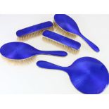 George V silver and Royal blue enamel five piece dressing set.