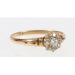 18ct yellow gold diamond ring, the central diamond approx 3mm or 0.1ct encircled by eight diamonds.