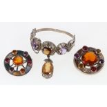 Two Scottish pebble and stone set targ brooches and an amethyst and citrine set bangle (3)