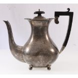 George V silver coffee pot of baluster form raised on four bun feet.