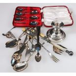 Silver dwarf candlestick, loaded, and various items of EP flatware.