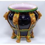 Large Minton style planter of tapering form with gadrooned rim over lion masks and lion paw feet,