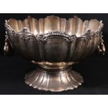 Silver large punch bowl, hemispherical fluted, with cast scroll border and drop handles,