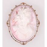 Victorian carved cameo, pale pink and white, carved with the head of a woman with plumed hair,