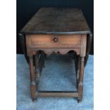 Georgian oak gate-leg table, the oval drop flap top over a frieze drawer,