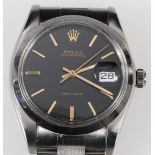 Rolex gent's Oysterdate watch, black dial, manual, in stainless steel with Rolex bracelet, c. 1960.