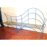 Large metalwork seat with shaped back and arched supports, 285cm wide.