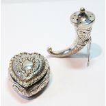 Silver embossed box of heart shape, Birmingham 1898, and a Norwegian pepperette of horn shape,