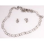 Silver necklet of hammered circular rings, with toggle, and a pair of earrings,