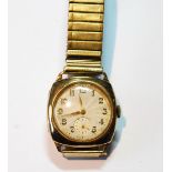 Gent's 9ct gold watch of tonneau shape, 1935, on bracelet.