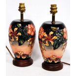 Pair of Moorcroft Oberon and Honeysuckle pattern table lamps, 28cm high.