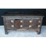 19th century oak coffer, the rectangular plank top over carved frieze panel, raised on block feet,