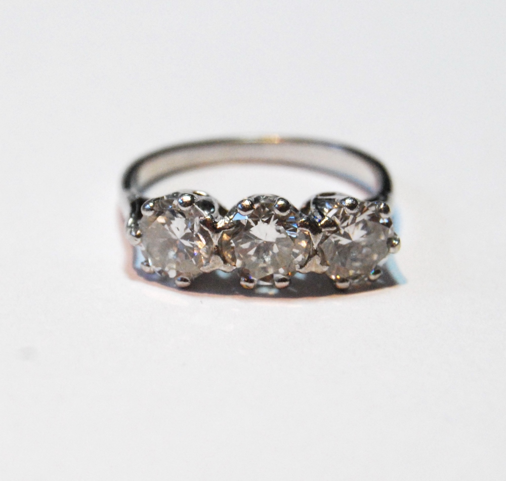 Diamond three-stone ring with brilliants, approximately .70ct each, size P.