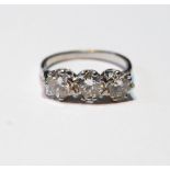 Diamond three-stone ring with brilliants, approximately .70ct each, size P.