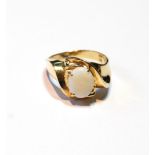 Ring with oval opal in gold scroll mount, '14k', size P.