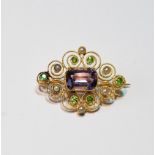 Gold brooch of millegrain scroll form with suffragette pearls,