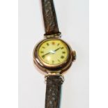 Lady's 9ct gold watch, 'red twelve', 1910, on strap.
