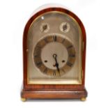 Gustav Becker bracket clock of arched form with brass and silvered face,