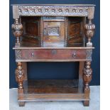 1920s oak court cupboard with cup and cover supports, some old timbers, 146cm high and 108cm wide.