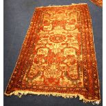 Persian rug, with all over floral design on cream ground and triple border, 185cm x 99cm.