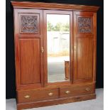 Edwardian mahogany three-door wardrobe,