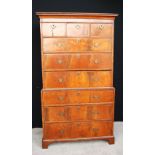 George III walnut chest on chest, the projected moulded cornice over three short drawers,