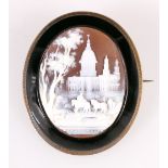 Victorian carved shell cameo depicting domed palaces with figures in jet surround and silver gilt