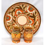 Charlotte Rhead charger, marked 4491, 32cm diameter, also a pair of Bennett vases, 13cm high.