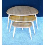 Ercol Golden Dawn beech and elm nest of three pebble tables.