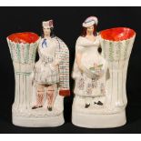 Staffordshire spill vase depicting a Scotsman and another of a flower seller.