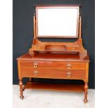 Mahogany dressing table, the rectangular swing mirror over open shelves and two short drawers,