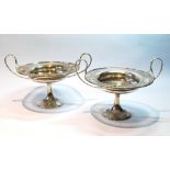 Pair of silver tazze, radially pierced, with loop handles upon spreading bases,