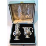Silver sugar caster and cream jug of baluster shape, each with celtic embossed band,