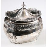 Victorian silver caddy of rectangular boat shape with embossed band and sprays, by Huttons, 1899.