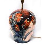 Moorcroft lamp base with tulip decoration, 30cm high.