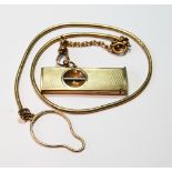 9ct gold snake key chain with engine turned Dunhill cigar cutter, gross 34g.