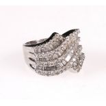 Dress ring with wavy bands of alternating baguette and brilliant-cut diamonds in white gold, '750'.