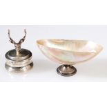 Silver mother of pearl salt on a silver base, 1912, and a stag's head menu stand.