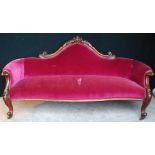 Victorian carved mahogany settee with serpentine seat, raised on cabriole legs and castors,