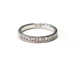 Half eternity ring with alternating baguette and brilliant-cut diamonds, in 18ct white gold.