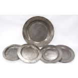 Antique pewter charger, 34cm diameter, also four circular plates.