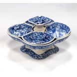 19th century blue and white pickle stand with quarter dishes.
