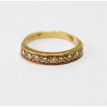 Diamond half-eternity ring with nine brilliants in 18ct gold, size L.