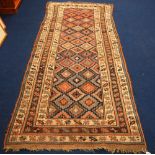 Persian long rug with all over cruciform and diamond design and triple border, 305cm x 119cm.