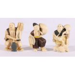 Three early 20th century Japanese carved ivory figures depicting a dancer,