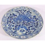 19th century Arita blue and white charger decorated with a kylin on a honeycomb ground with