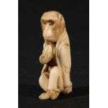 Carved Japanese ivory netsuke of a seated monkey wearing traditional clothes holding a peach, 5.